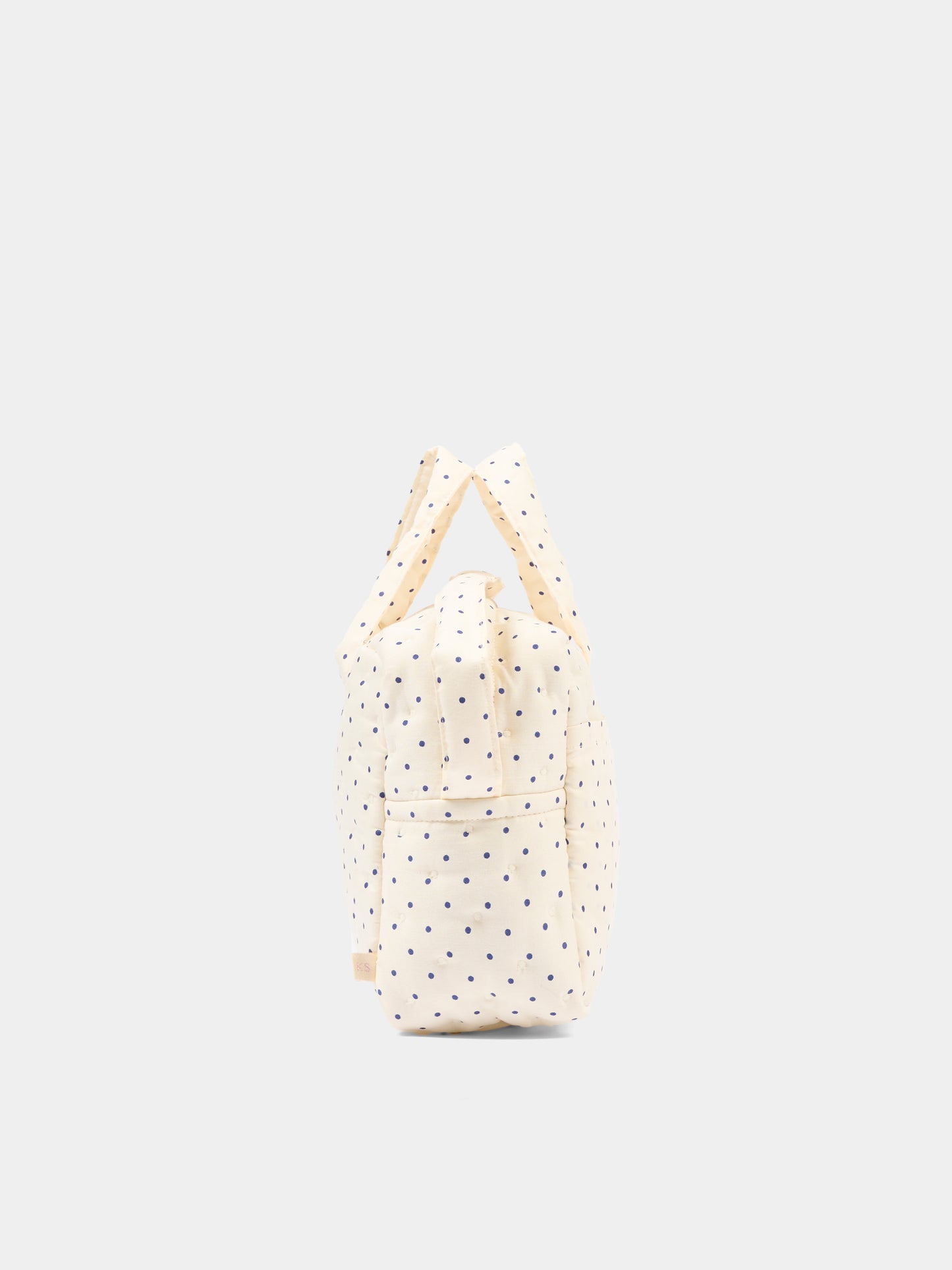 Ivory sensory play bag for girl with polka dots