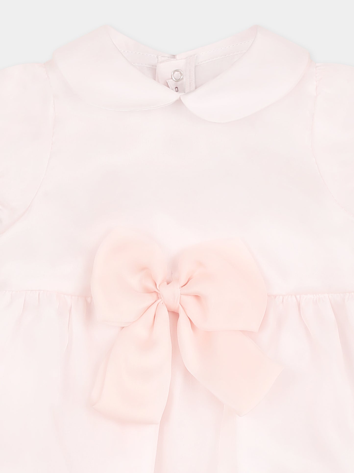 Pink romper for baby girl with bow