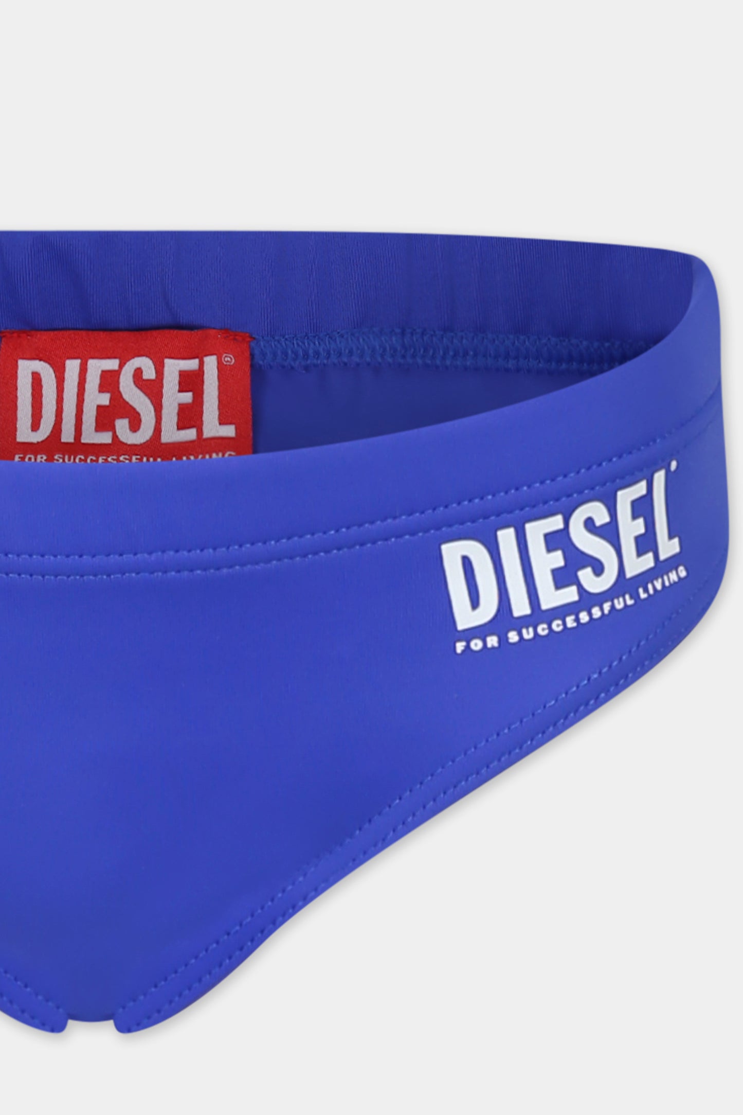 Blue swim briefs for boy with logo