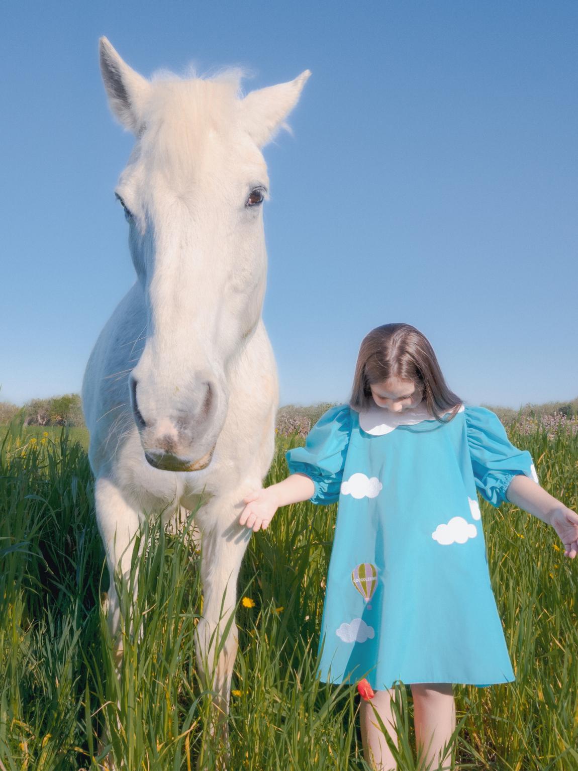 Light blue dress for girl with clouds and hot air balloon